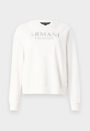 Felpa bianca con la scritta "ARMANI EXCHANGE" in argento metallico. Collo a giro, maniche lunghe e polsini e orlo a costine.