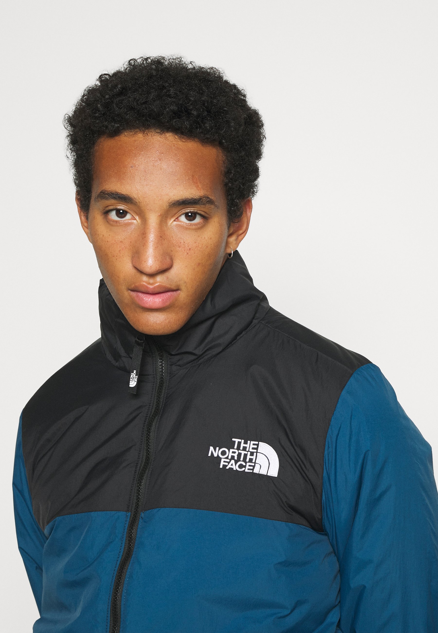 blue north face jacket windbreaker