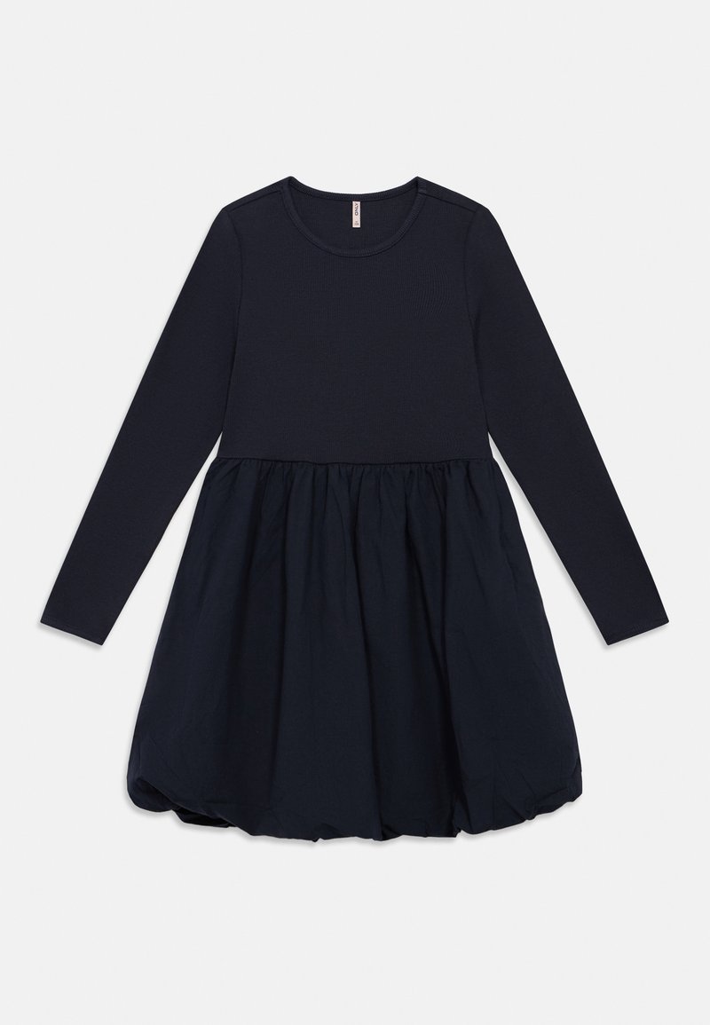 Φόρεμα με μακριά μανίκια σε ναυτικό μπλε, με εφαρμοστό μπούστο και φούστα με πιέτες. Κατασκευασμένο από υφές με ριμπ ύφανση και λείο ύφασμα, με στρογγυλή λαιμόκοψη.