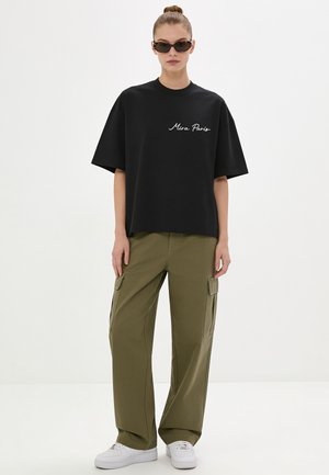 Mira Paris, ESSENTIAL OVERSIZED BOXY TEE 26 UNISEX - T-shirt basique - black