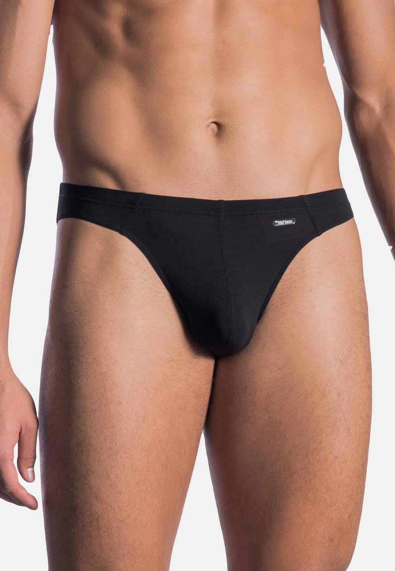 Male torso wearing black brief-style underwear against a plain white background.