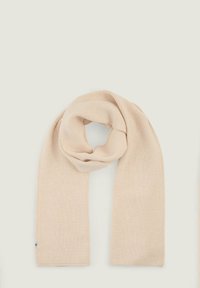 Beige ribbed knit scarf with a soft texture, featuring a logo tag at the end. The design is long and rectangular in shape.