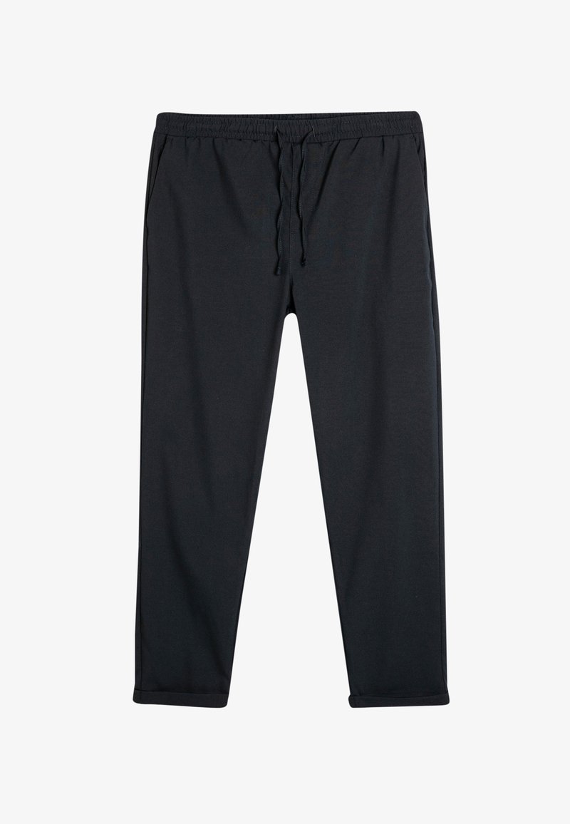 Sorte, lette sweatpants med elastisk talje og snøre, med sidelommer og tapered manchetter. Blød tekstur.