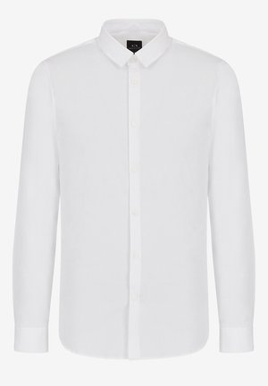 Camicia bianca a maniche lunghe con bottoni, realizzata in tessuto leggero. Presenta un colletto classico, chiusura frontale con bottoni e orlo dritto con polsini.