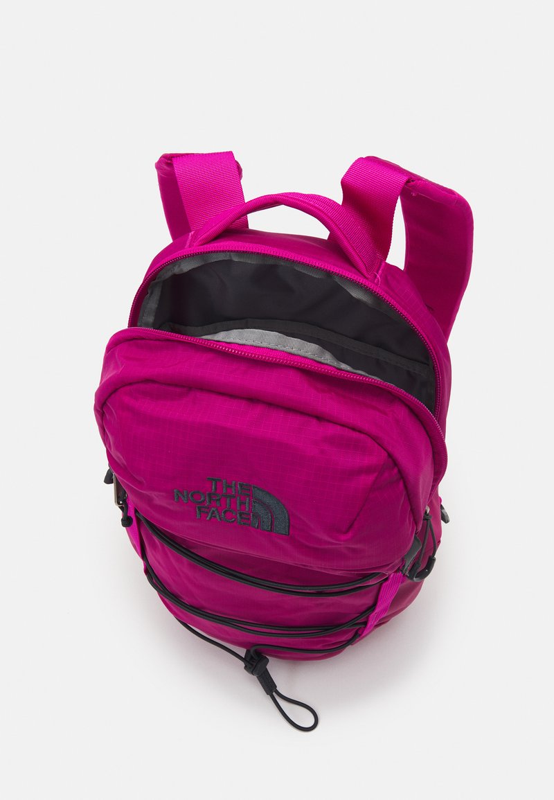 dark pink north face backpack