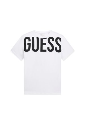 Wit T-shirt met korte mouwen, grote zwarte "GUESS" tekst over de borst, ronde halslijn en een strak minimalistisch ontwerp.