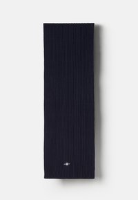 Ribbede marineblå tørklæde lavet af blødt stof, med intrikate teksturer og et lille logo i bunden. Lang og rektangulær form.
