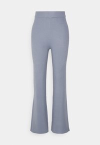 Ribbade, utsvängda byxor i ljusblått tyg med hög midja. Texturen är mjuk och elastisk, vilket ökar komforten och passformen.