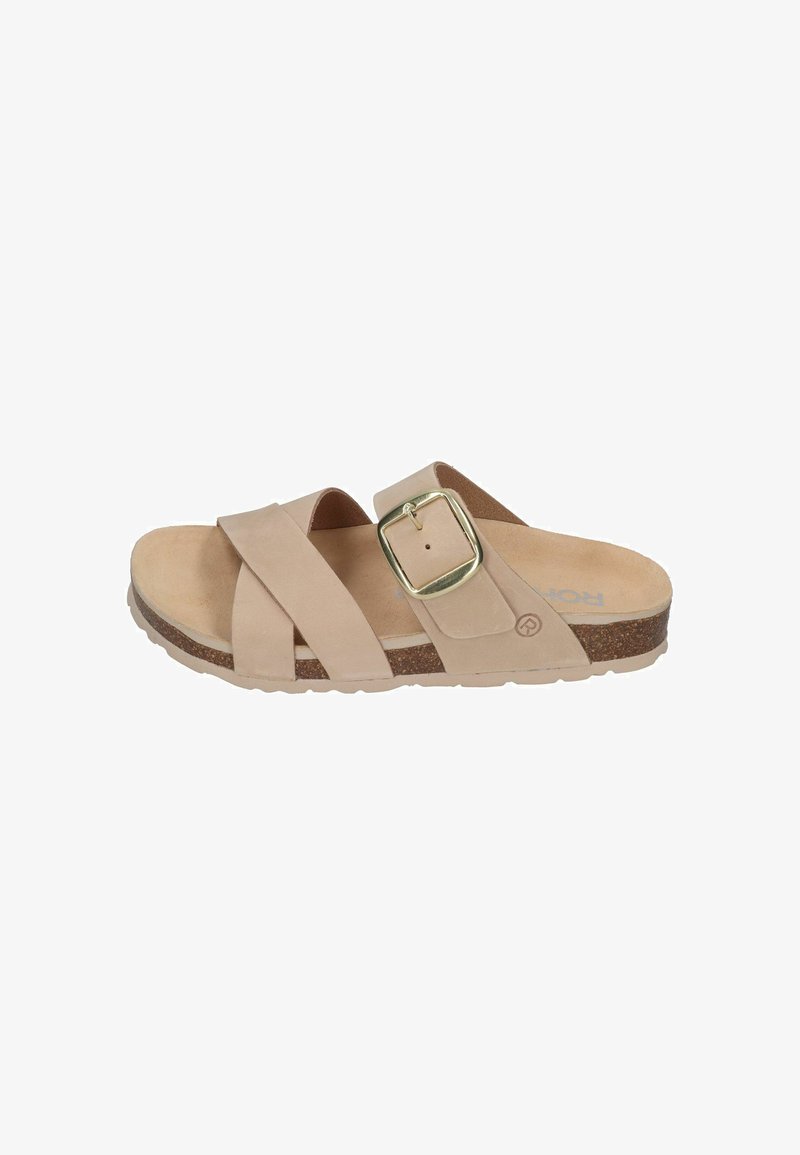 Beige slip-on sandal with two wide straps crossing, one with a large gold buckle, cork sole, and textured rubber outsole.