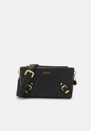 Black textured leather crossbody bag with gold hardware, featuring adjustable strap, zip closure, and two buckle accents on the front.