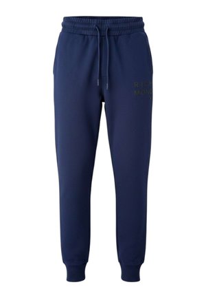 Pantaloni della tuta blu navy con coulisse, vita e polsini elasticizzati, con un testo discreto sulla parte superiore della coscia sinistra.