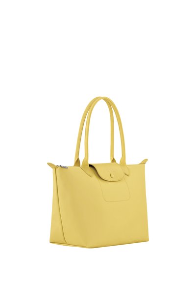Yellow leather tote bag with dual shoulder straps, a front flap with button closure, and a zippered top opening.