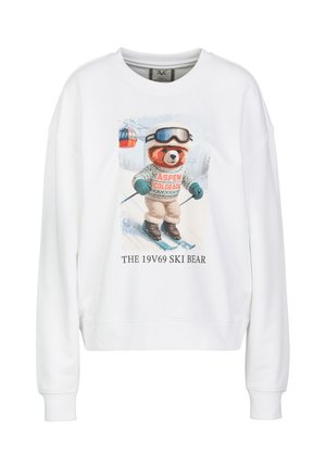 Witte trui met een afbeelding van een beer die aan het skiën is, met een skibril en een trui met de tekst Aspen Colorado, met de tekst hieronder The 19V69 Ski Bear.