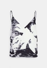 Top senza maniche con scollo a V in bianco, caratterizzato da un motivo astratto di foglie nere. Realizzato in tessuto morbido con una vestibilità comoda.