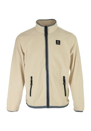 Giacca in pile beige con colletto alto, chiusura frontale a zip e due tasche laterali. Presenta zip nere e un bordo blu lungo il fondo.