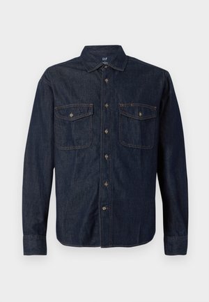 Dark denim shirt with long sleeves, button-up front, two chest pockets, pointed collar, and contrast stitching. Soft texture and classic fit.
