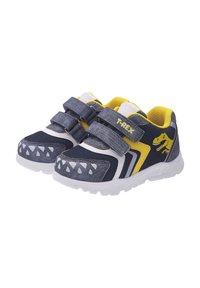 Zapatillas azul y gris con tiras de velcro, detalles amarillos y gráficos de dinosaurios. Presentan una parte superior texturizada y una suela de goma blanca.