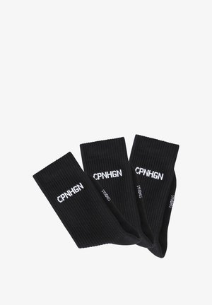 Black ribbed socks featuring white text "CPNHGN" along the cuff. Soft fabric, mid-calf length, suitable for casual wear.