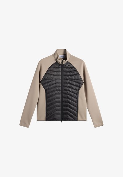 Beige og sort fuld-zip jakke med quiltet sort frontpanel og glatte beige ærmer og skuldre, stående krave, ingen synlige logoer.