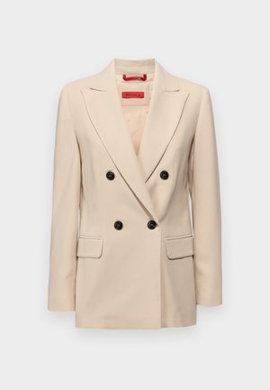 Bēšas dubultās krūškurves žakete ar ieliektu apkakli, melnām pogām un divām priekšējām kabatām. Iezīmēta ar pielāgotu dizainu un gludu audumu.