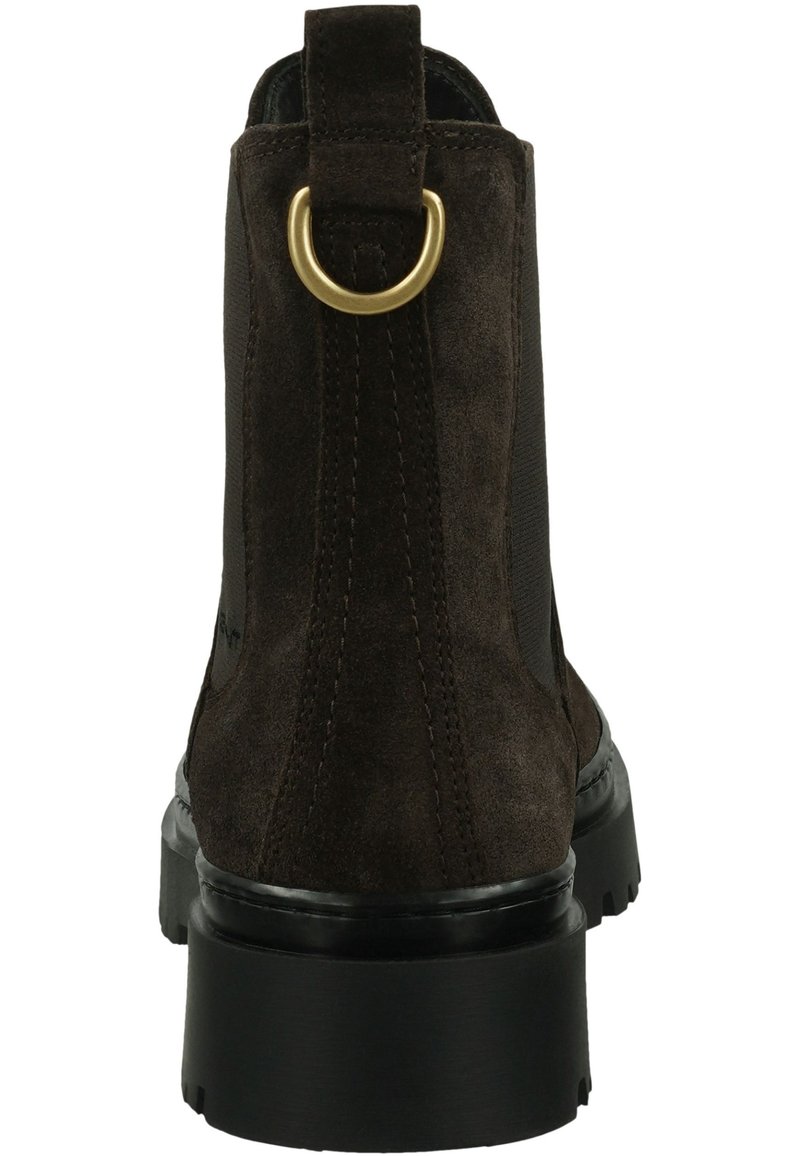 Dunkelbraune Wildleder-Stiefelette mit schwarzer, robuster Sohle und einem goldenen Metallring an der Rückenschlaufe.