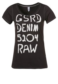 Black t-shirt made of cotton with short sleeves, featuring white, handwritten style text "GSRD DENIM 5204 RAW" in bold lettering.