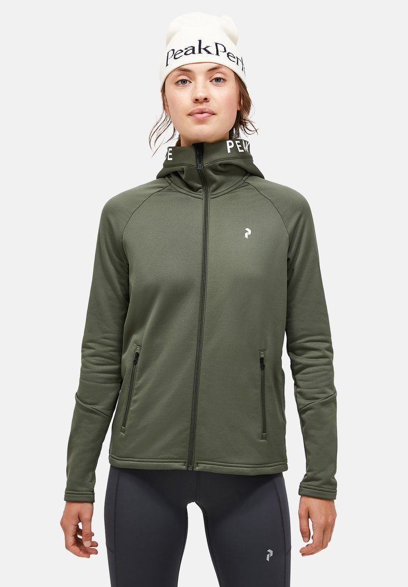 Olive green zip-up jacket with high collar and dual side pockets. Made of soft, flexible material, featuring sleek design and minimal branding.