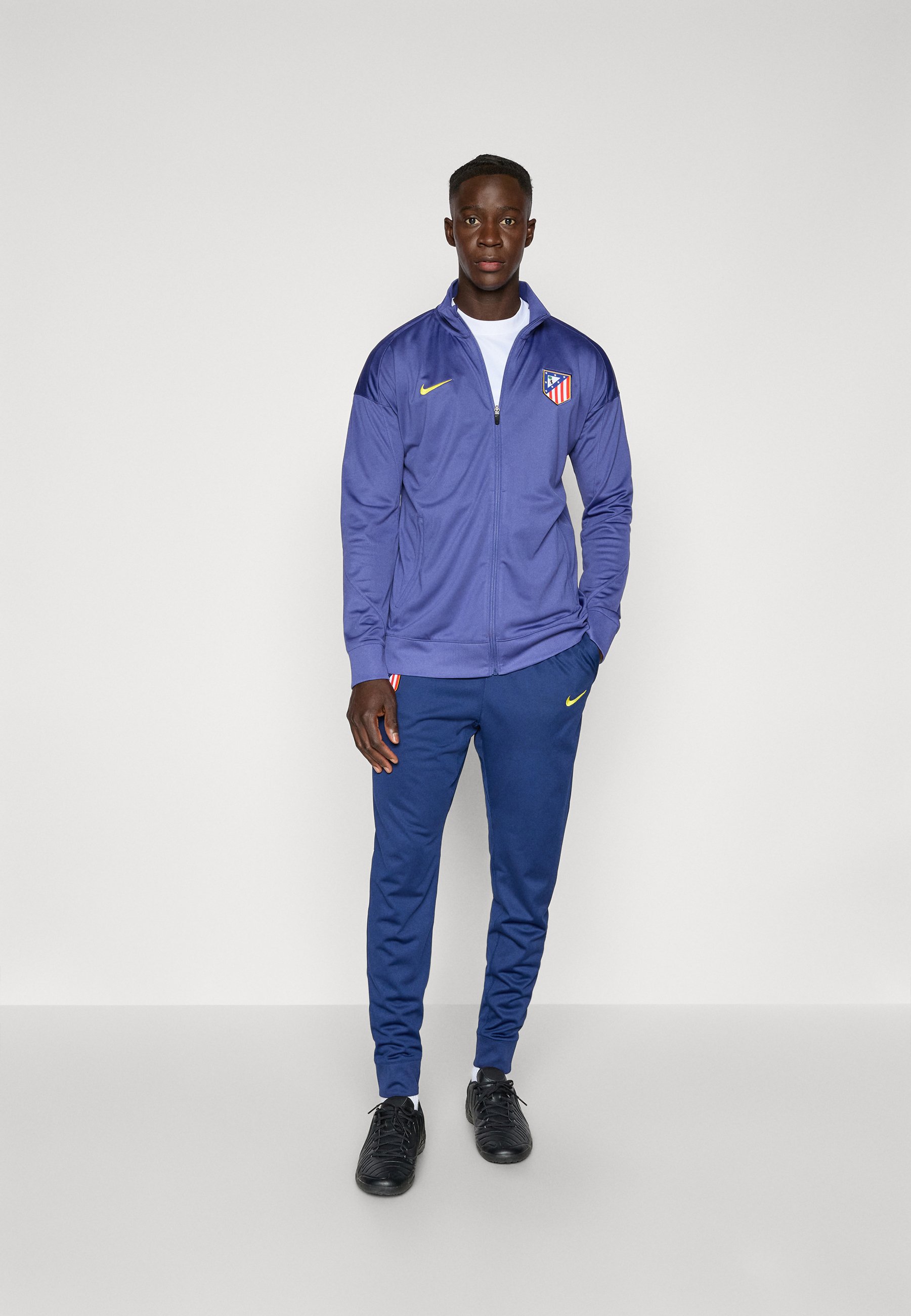 yellow and navy blue nike outfit