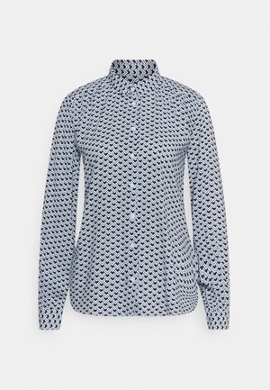 Langarm overhemd met knopen in blauw en wit met een herhalend zigzagpatroon. Bevat een kraag en knoopsluiting aan de voorkant.