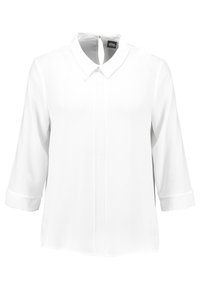 Blusa bianca con colletto classico, maniche a 3/4, piastra frontale e una texture in tessuto liscio e tessuto. Chiusura con zip sul retro.