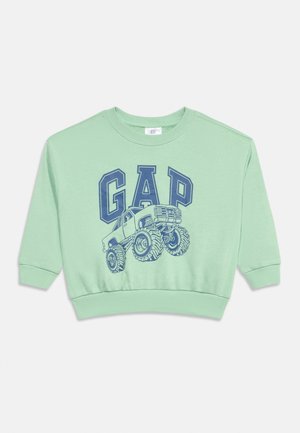 Sweat-shirt à manches longues vert menthe avec texte "GAP" bleu marine et graphique d'un monster truck sur le devant, avec poignets et ourlet côtelés.