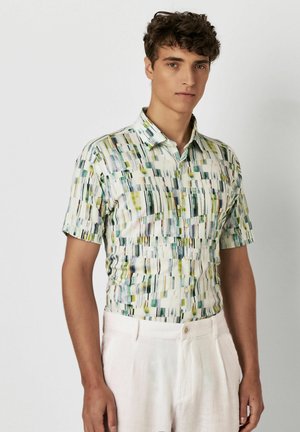 Kortærmet skjorte med knapper i let stof med et farverigt vertikalt mønster i grøn, blå og gul. Har krave og knapper.