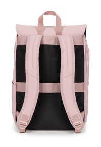 Pink and black backpack with adjustable straps, top handle, textured fabric, roll-top design, and zipper detail on the side.