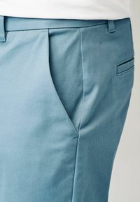 Next SLIM FIT STRETCH - Chino hlače - light blue
