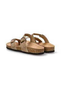 Sandalias de corcho beige con dos correas ajustables, hebillas de metal y plantillas texturizadas. Suela plana con una suela exterior de goma oscura.