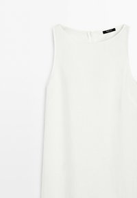 Sleeveless white dress with a high round neckline and back zipper closure on a plain light background.