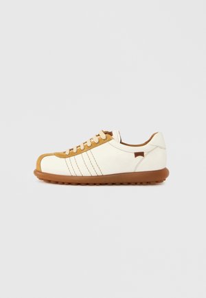 White and tan leather casual sneaker with brown rubber sole and beige laces, shown in side profile on plain background.