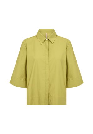 Chemise jaune-vert à manches courtes avec boutons et manches larges, col pointu, présentée sur un fond blanc.