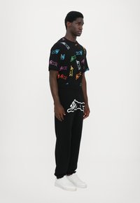 Icecream RUNNING DOG SWEATPANTS - Tracksuit bottoms - black