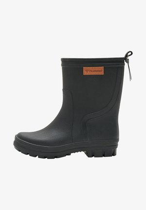 Black rubber ankle boot with textured surface, non-slip sole, and a brown leather patch featuring embossed logo on the outer side.