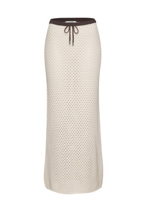 Beige knitted maxi skirt with textured honeycomb pattern, dark brown elastic waistband, and front drawstring tie.