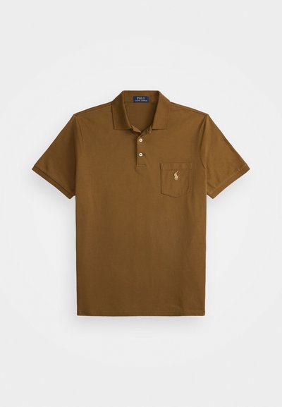 Brown polo shirt made of cotton with a collar, two button placket, and a left chest pocket featuring an embroidered logo. Short sleeves.