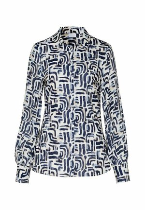 Langärmlige Bluse mit Knopfleiste in schwarz-weißem abstraktem geometrischen Muster und klassischem Kragen.