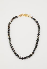 Collier en perles noires et irisée avec un fermoir en or. Perles rondes de tailles variées, agrémentées d'une délicate chaîne.