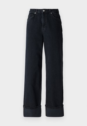 Jeans a gamba larga in denim blu scuro con vita alta, dotati di chiusura a bottone, cinque tasche e orli arrotolati.