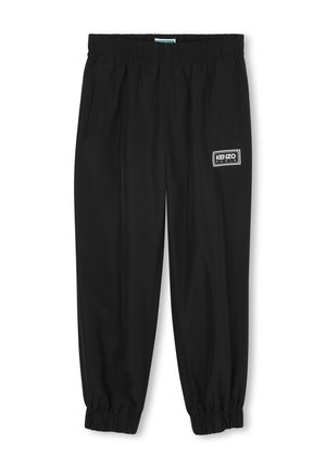 Zwarte joggerbroeken met elastische tailleband, zijsokken, ribgebreide manchetten en een witte logopatch met "KENZO Paris" op de voorkant.
