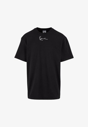 Camiseta de algodón negra con mangas cortas, cuello redondo y un logo gráfico blanco impreso en el pecho. Corte clásico y textura suave.