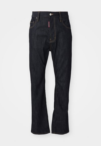 Tumedat sinised sirged teksad kollaste õmblustega, ees nupuga, tõmblukuga ja punase sildiga parema tasku serval.