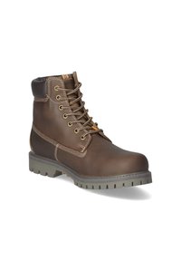 Bottines en cuir marron avec lacets beige, semelle en caoutchouc grise, col rembourré et détail de couture blanche. Construction durable pour une utilisation robuste.