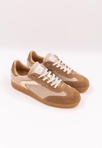 Pair of beige and brown lace-up sneakers with textured fabric and suede details on a white background.